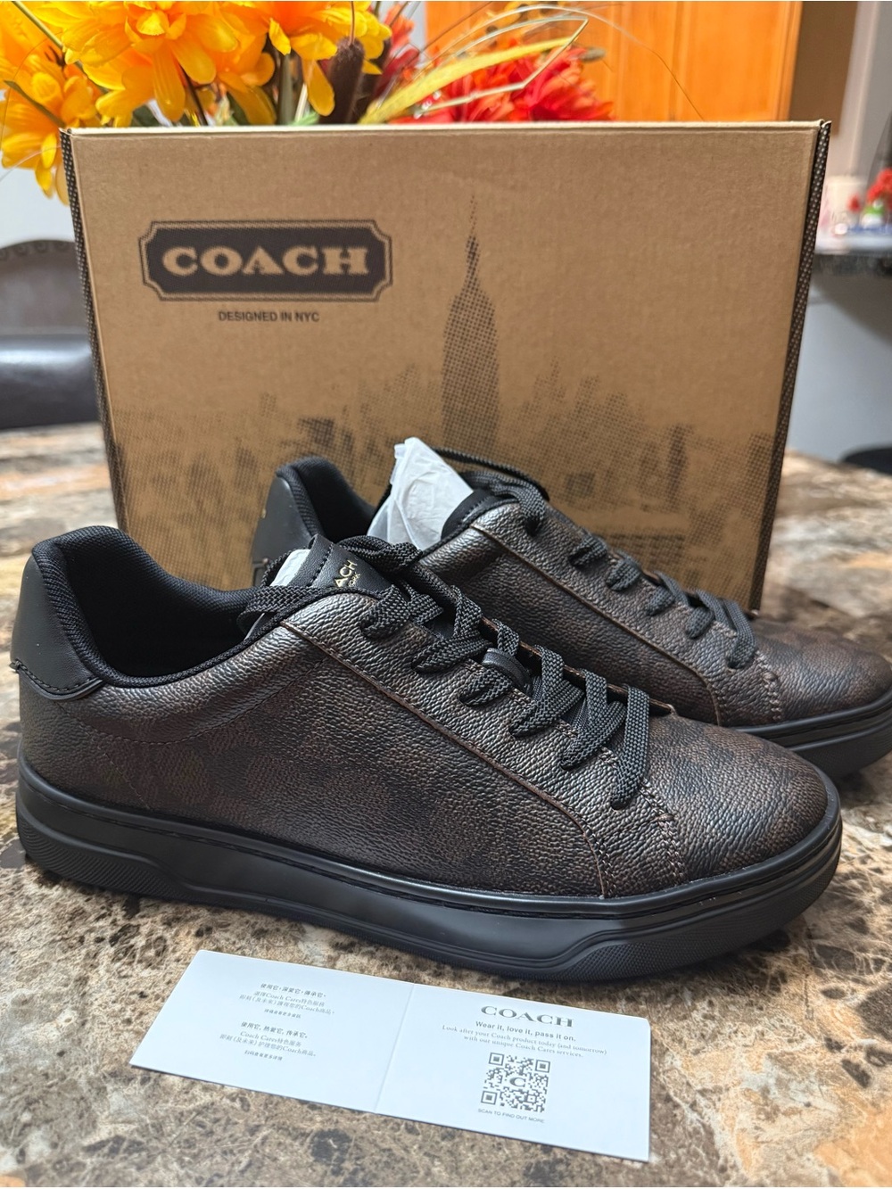 Women’s size 8 Coach High line Sneakers in Walnut/Black.